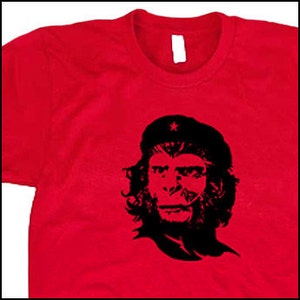 May include: A red t-shirt with a black and white image of a monkey wearing a star-emblazoned beret. The monkey's face is reminiscent of Che Guevara.
