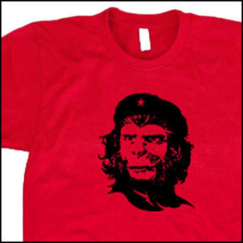 May include: A red t-shirt with a black and white image of a monkey wearing a star-emblazoned beret. The monkey's face is reminiscent of Che Guevara.