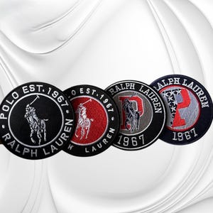 May include: Four circular embroidered patches featuring the Ralph Lauren Polo logo. The first is black with white text, the second is red with white text, the third is black with a grey letter P, and the fourth is navy with a red P and white stars.