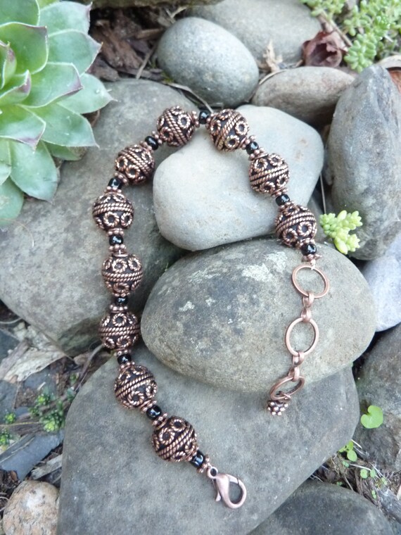 Items similar to African Copper Wire Wrapped Beads Bracelet with Glass Beads Accent on Etsy