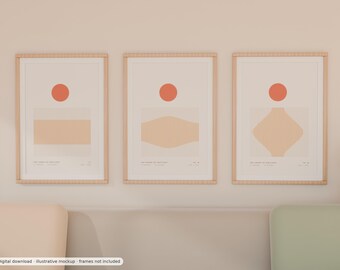 May include: Three vertical wall art prints in light wood frames, each featuring a solid orange circle above a beige geometric shape with fine vertical lines. The prints include small text at the bottom, displaying the titles and coordinates.