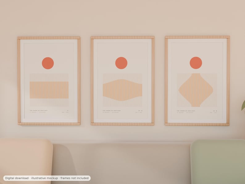 May include: Three vertical wall art prints in light wood frames, each featuring a solid orange circle above a beige geometric shape with fine vertical lines. The prints include small text at the bottom, displaying the titles and coordinates.
