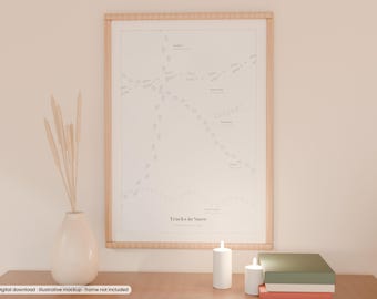 May include: A framed wall art print titled Tracks in Snow featuring a white background with various grey animal footprint patterns and labels. The print is displayed in a light wood frame alongside a white vase with dried stems and candles.