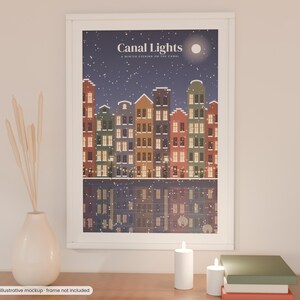 May include: A framed wall art print titled Canal Lights, A Winter Evening on the Canal, featuring a row of colorful houses along a canal at night with falling snow, a full moon, and glowing windows reflected in the dark water below.