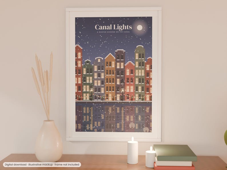 May include: A framed wall art print titled Canal Lights, A Winter Evening on the Canal, featuring a row of colorful houses along a canal at night with falling snow, a full moon, and glowing windows reflected in the dark water below.