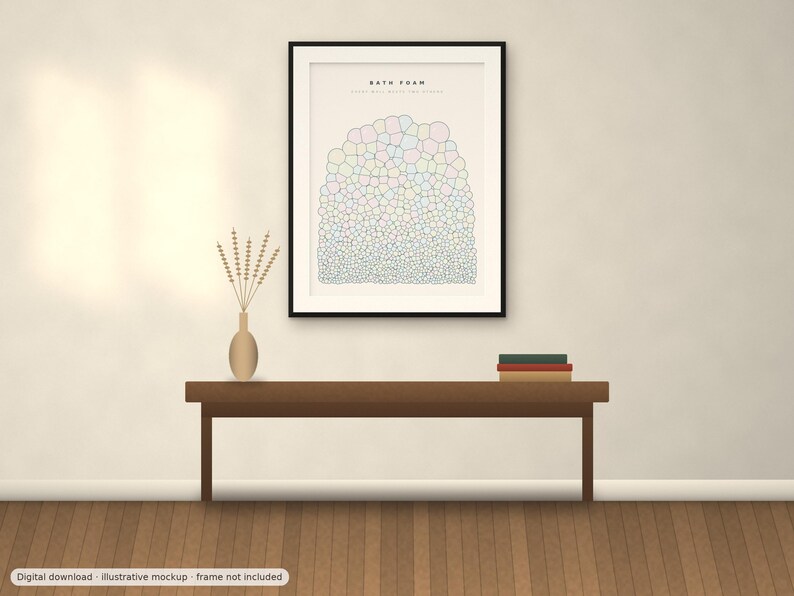 May include: A framed wall art print titled BATH FOAM featuring a graphic illustration of multicolored bubbles in varying sizes arranged in a rounded cluster, displayed in a black frame hanging above a wooden bench with a vase and books.