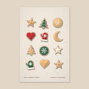Puede incluir: Una l&aacute;mina rectangular con doce galletas navide&ntilde;as ilustradas en forma de estrellas, &aacute;rboles, corazones, manoplas y una luna creciente. El texto THE COOKIE TRAY y baked for december aparece en letras negras en la parte inferior.
