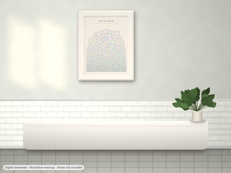 May include: A framed wall art print titled BATH FOAM featuring a graphic illustration of numerous small, multicolored bubbles arranged in a dense, rounded cluster. The artwork is displayed in a light-colored frame on a wall above a white shelf.