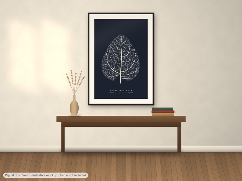 May include: A framed wall art print featuring a white skeletal leaf illustration on a dark navy blue background. The text "BROWN LEAF No. 2" is printed in white at the bottom center of the artwork. The print is displayed in a black frame.