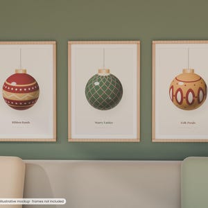 May include: Three framed wall art prints featuring Christmas ornaments. The left print shows a red ornament labeled Ribbon Bands, the center a green one labeled Starry Lattice, and the right a gold one labeled Folk Petals.