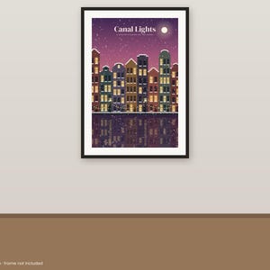 May include: A rectangular wall art print titled Canal Lights, A Winter Evening on the Canal. The illustration features a row of colorful houses with glowing windows reflecting in the water under a purple night sky with snow and a moon.