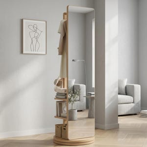 Puede incluir: Un espejo de pie giratorio, alto y rectangular, hecho de madera clara con una unidad de almacenamiento integrada en la parte posterior. El lado de almacenamiento cuenta con una barra para colgar ropa, estantes abiertos y dos cajas.