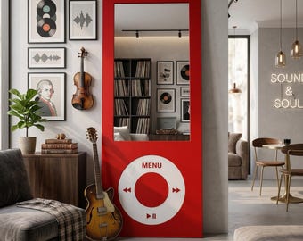 May include: A tall, rectangular red floor mirror designed to resemble a vintage digital music player. The upper section features a large vertical mirror, while the lower section displays a white circular control interface with the text MENU.
