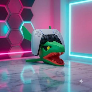 May include: A green dragon-shaped controller stand featuring a wide-open mouth with red interior details and yellow eyes. A white and black wireless game controller is mounted securely on top of the dragon head, serving as a display holder.