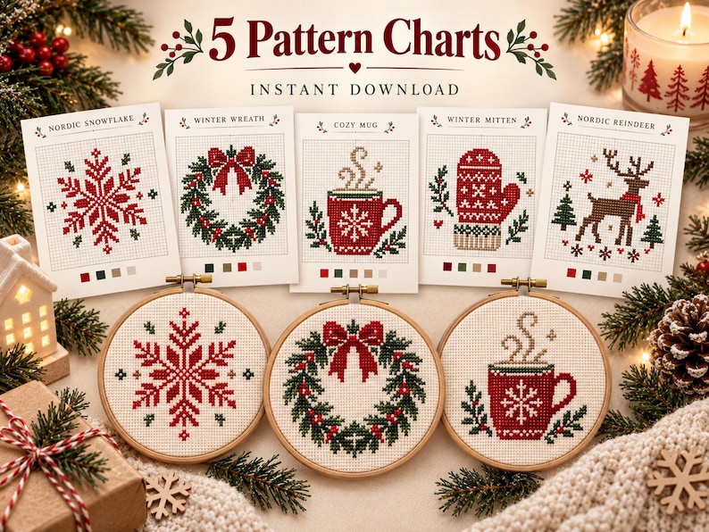 May include: Five cross-stitch pattern charts featuring a Nordic snowflake, winter wreath, cozy mug, winter mitten, and Nordic reindeer. Below the charts are three wooden embroidery hoops displaying the snowflake, wreath, and mug designs.