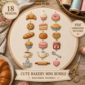 Peut inclure: Un tambour à broder présentant 18 motifs numérotés sur le thème de la boulangerie sur un tissu crème, incluant un croissant, un cupcake, un donut, un biscuit, une part de gâteau, une tarte, du pain, une gaufre, un muffin, un macaron et un pot.