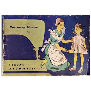 May include: Vintage "Viking Automatic Class 21" sewing machine operating manual. The cover features an illustration of a woman and a girl, with the woman wearing an apron with red polka dots. The background is dark blue with text in green and white.