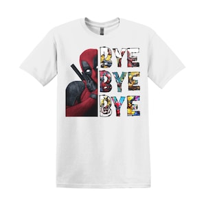 May include: A white short-sleeved t-shirt featuring a graphic of the character Deadpool on the left side. To the right, the word BYE is printed three times in a stacked vertical layout, with each letter containing small images of comic characters.