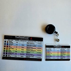 May include: Two rectangular reference cards titled ThePhlebCard Order of Draw, featuring a color-coded table of blood collection tubes, additives, and inversion counts. A black retractable badge reel is attached to the smaller card.