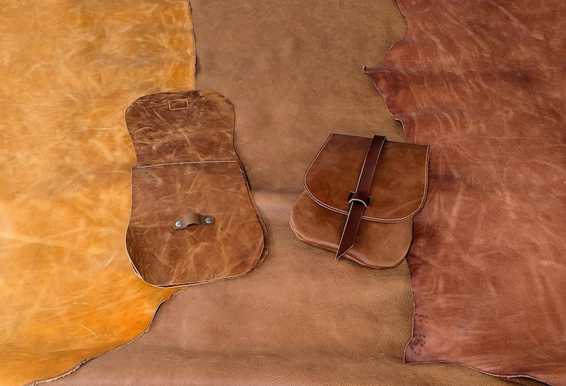 Brown leather hide color range: orange/yellow brown, soft medium-tan brown, red brown. The original batch colors are layed on top of the current hides, these colors are no longer available.