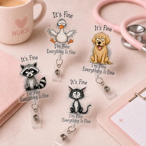 May include: Four acrylic badge reels featuring cartoon animals including a raccoon, a duck, a golden retriever, and a black cat. Each character has a tired expression with the text It's Fine, I'm Fine, Everything Is Fine printed above and below.