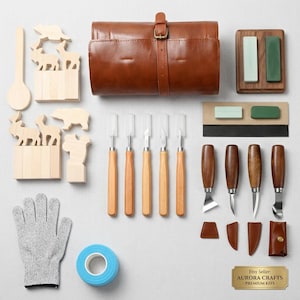 May include: A wood carving kit featuring a brown leather tool roll, five wooden-handled chisels, four metal carving knives with leather sheaths, two sharpening stones, a grey cut-resistant glove, a blue tape roll, and various animal-shaped wood blocks.