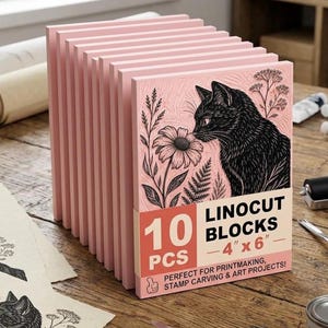May include: A stack of ten pink rectangular linocut blocks, each measuring 4 inches by 6 inches. The front block features a black ink illustration of a cat surrounded by flowers and ferns. A paper band displays the text 10 PCS LINOCUT BLOCKS 4 x 6.
