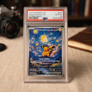 May include: A graded 2023 Pokemon SVP Pikachu with The Starry Night trading card in a clear plastic slab. The card features a yellow Pikachu character against a blue, swirling night sky background with a bright moon and the text Pikachu with The Starry Night.