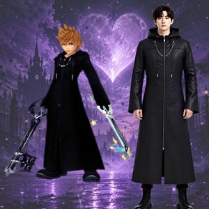 May include: A long black hooded coat with a front zipper closure and a silver chain detail at the neckline. The coat features long sleeves and a structured fit, shown alongside a character wearing an identical black hooded coat and holding two swords.