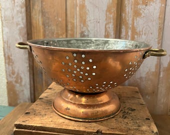 Vintage copper colander with brass handles