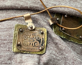 Artisan, handmade mixed metal pendants, brass,and copper,balled rivet, imprinted pendants
