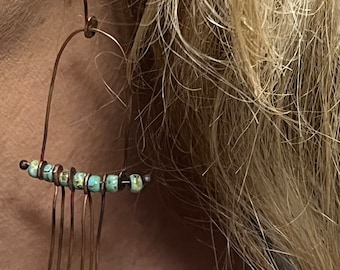 Long dangle Hinged earrings with green Picasso beads