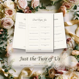 May include: A set of printed cards titled Date Night Jar, featuring a grid of eight date ideas, conversation starters, and a bucket list. The cards are cream-colored with dark text and are surrounded by a floral arrangement of pink roses.