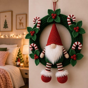 May include: A dark green crocheted wreath featuring a central gnome with a red hat, white beard, and striped legs. The wreath is decorated with crocheted holly leaves, red berries, and red and white striped candy canes attached to the ring.