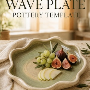 May include: A wavy-edged ceramic plate with a speckled cream and sage green glaze. The text WAVE PLATE POTTERY TEMPLATE is displayed above. The plate holds a cluster of green grapes, two whole figs, two sliced figs, and three apple slices.