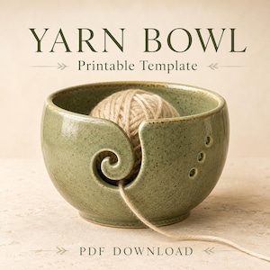 May include: A sage green ceramic yarn bowl with a speckled finish, featuring a spiral cutout and three small circular holes. A ball of beige yarn sits inside the bowl with a strand extending outward. Text reads YARN BOWL Printable Template PDF DOWNLOAD.