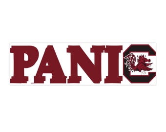 May include: A rectangular sticker featuring the word PANIC in bold, dark maroon block letters. The letter C is stylized as a large black and maroon block letter containing a graphic illustration of a maroon gamecock bird facing left.