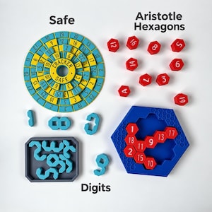 May include: A puzzle set featuring a circular blue and yellow dial labelled Cracker Safe, red hexagonal tiles with white numbers, a blue hexagonal tray with a honeycomb pattern, and a grey tray containing various light blue geometric shapes.