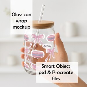 May include: A clear glass can with a wooden lid and a clear straw. The glass is decorated with pink bows and macarons. The text "Glass can wrap mockup" and "Smart Object psd & Procreate files" are visible.