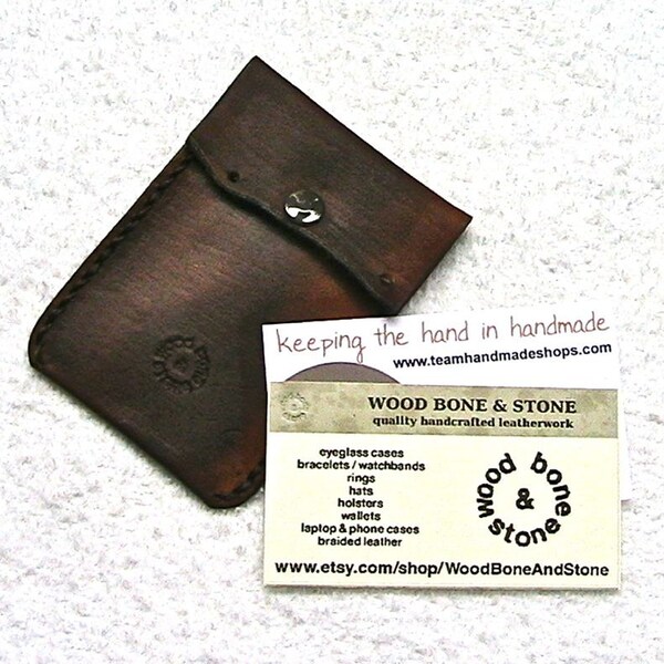 Brown leather business card case.