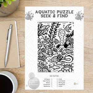 May include: A black and white activity sheet titled Aquatic Puzzle Seek & Find featuring a detailed underwater scene with a sea turtle, octopus, shark, and various fish. Below the illustration is a checklist of items to find and color.