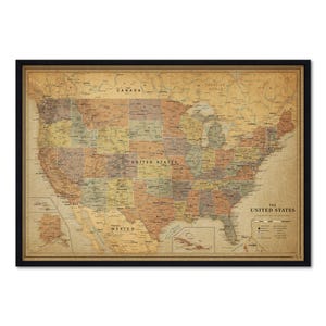 May include: A framed vintage-style map of the United States featuring muted earth tones, state boundaries, and major cities. The map includes text labels for Canada, Mexico, and The United States, with a legend in the lower right corner.