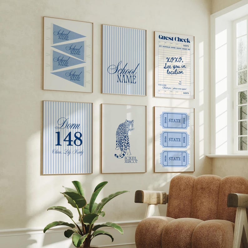 May include: A gallery wall of six framed prints featuring blue and white designs. The prints include school pennants, blue vertical stripes with text, a guest check form, a dorm room sign, a leopard illustration, and three blue ticket stubs.