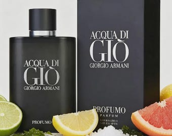 May include: A matte black rectangular perfume bottle and matching box labeled ACQUA DI GIO GIORGIO ARMANI PROFUMO. The set is surrounded by fresh lime and grapefruit slices, green seaweed, and a small pile of white sea salt crystals.