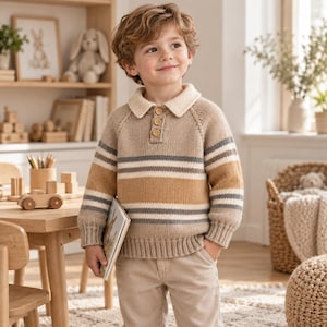 May include: A long-sleeve knit sweater featuring a beige base with horizontal stripes in white, grey, and mustard yellow. The sweater has a collared neckline with a three-button placket, ribbed cuffs, and a ribbed hem, paired with light beige trousers.
