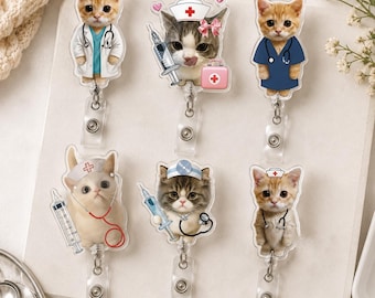 May include: Six acrylic badge reels featuring illustrations of kittens dressed as medical professionals. The designs include cats wearing white lab coats, blue scrubs, nurse caps, and stethoscopes, with accessories like syringes and medical kits.