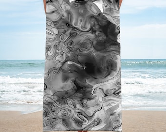 May include: Black and white beach towel with an abstract design featuring swirling lines and shapes. The design resembles an octopus or other sea creature.