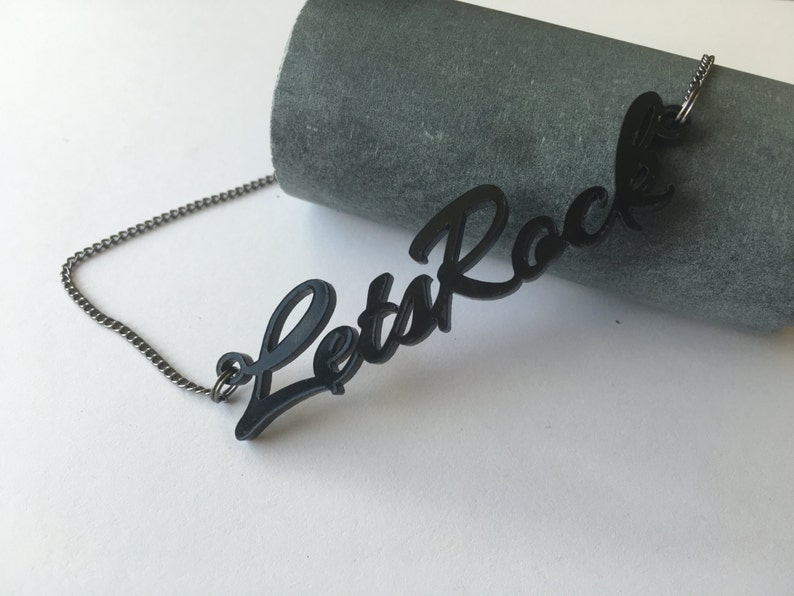 Let's Rock Aliens movie inspired black acrylic lasercut necklace image 1