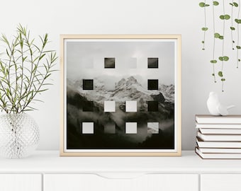 May include: A framed print of a mountain landscape with a grid pattern overlay. The image is in black and white and shows a mountain range with snow-capped peaks and mist in the valleys.