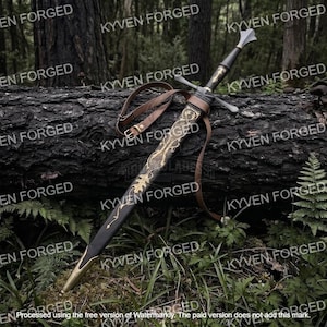 May include: A longsword with a black grip and a crossguard, accompanied by a black scabbard featuring intricate gold-colored metal filigree in a leaf pattern. The scabbard includes a brown leather strap with a metal buckle for carrying purposes.